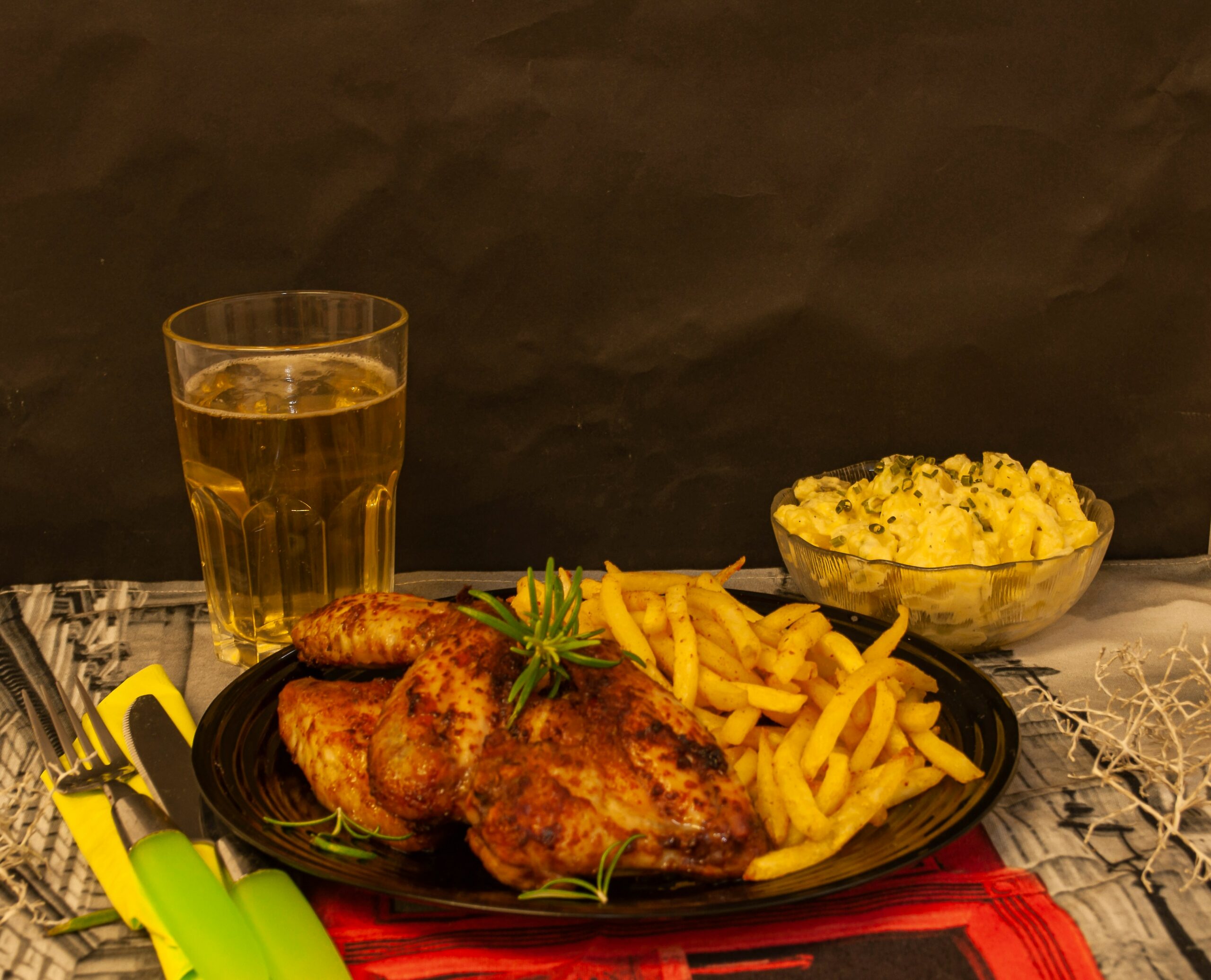 fried chicken on red and white ceramic plate