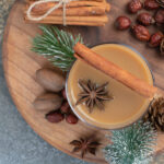 hot buttered rum cocktail with cinnamon stick on a tray